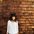 Stitch Fix on Facebook: Woman in front of wood-shingled building